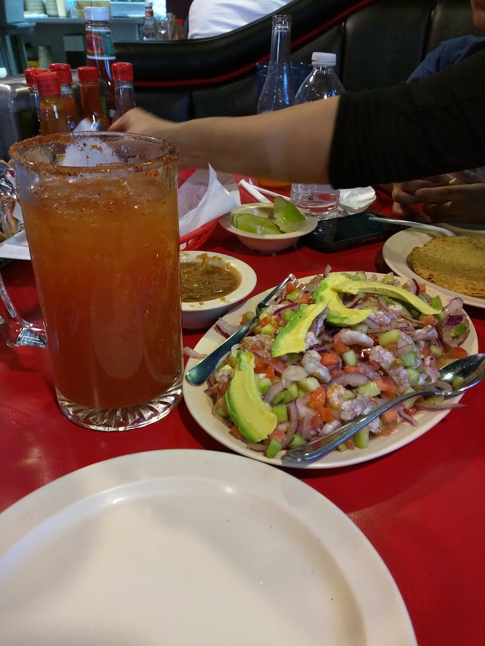 Printed menu featuring Mexican seafood dishes.