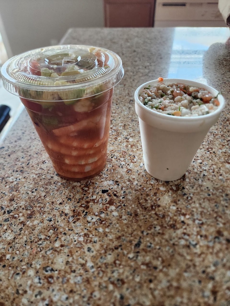 Menu page listing mariscos and drinks.