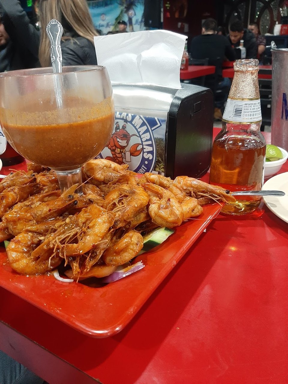Printed menu featuring Mexican seafood dishes.