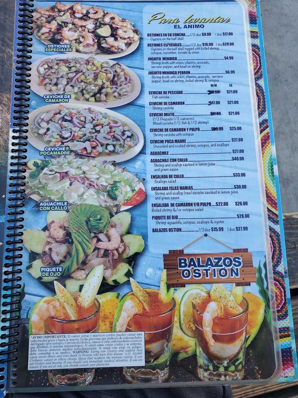 Printed menu featuring Mexican seafood dishes.